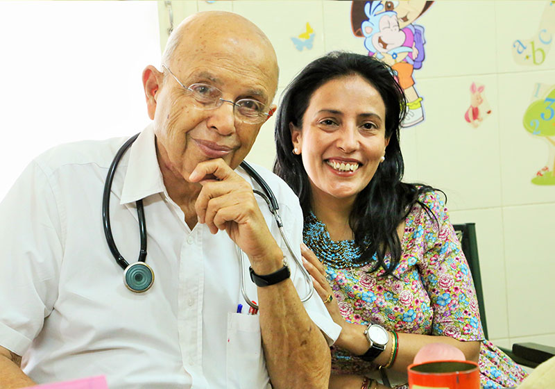 Dr. Adenwalla smiling with Mamta Carrol
