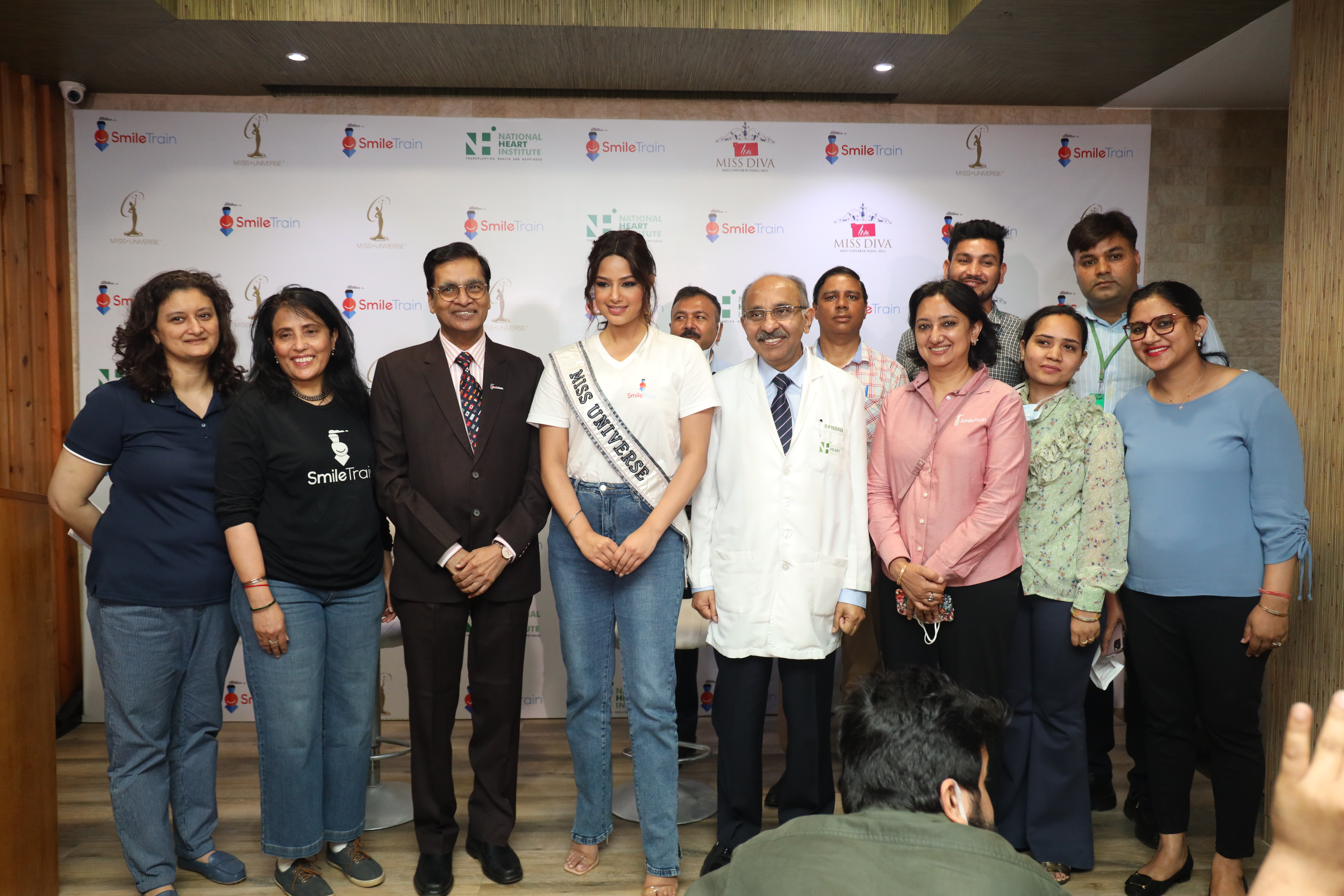 Harnaaz Sandhu smiling with doctors and the Smile Train India team