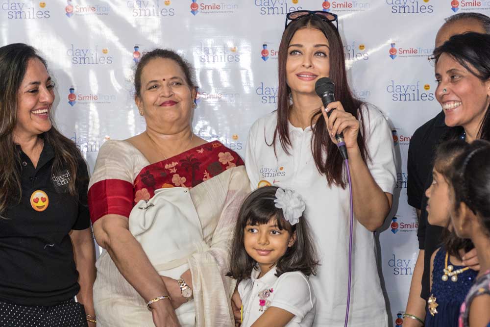 Aishwarya Rai Bachchan smiling with a microphone