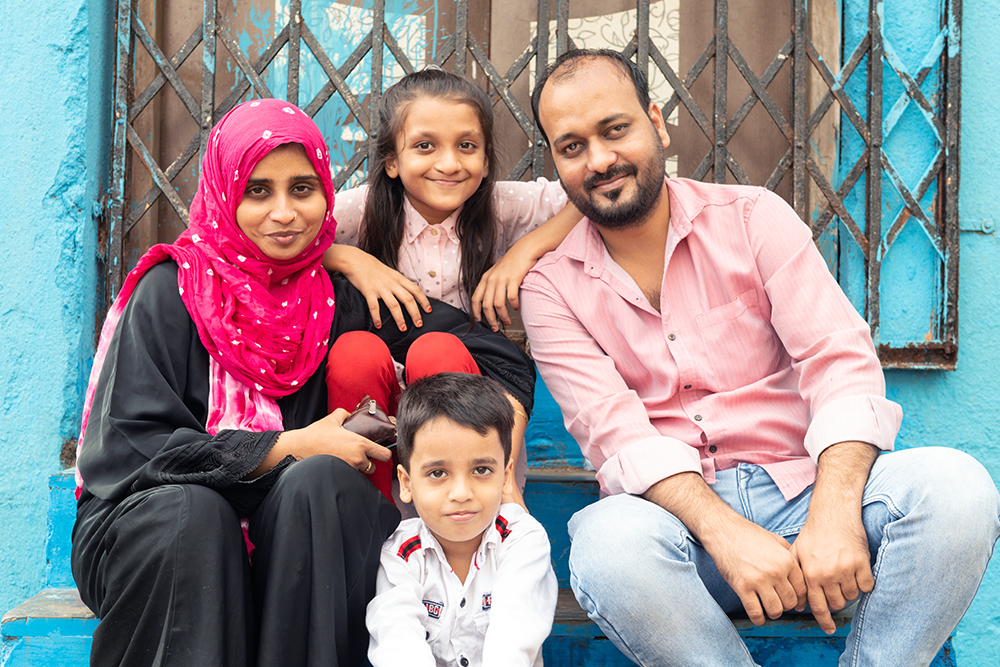 Humera smiling with her immediate family