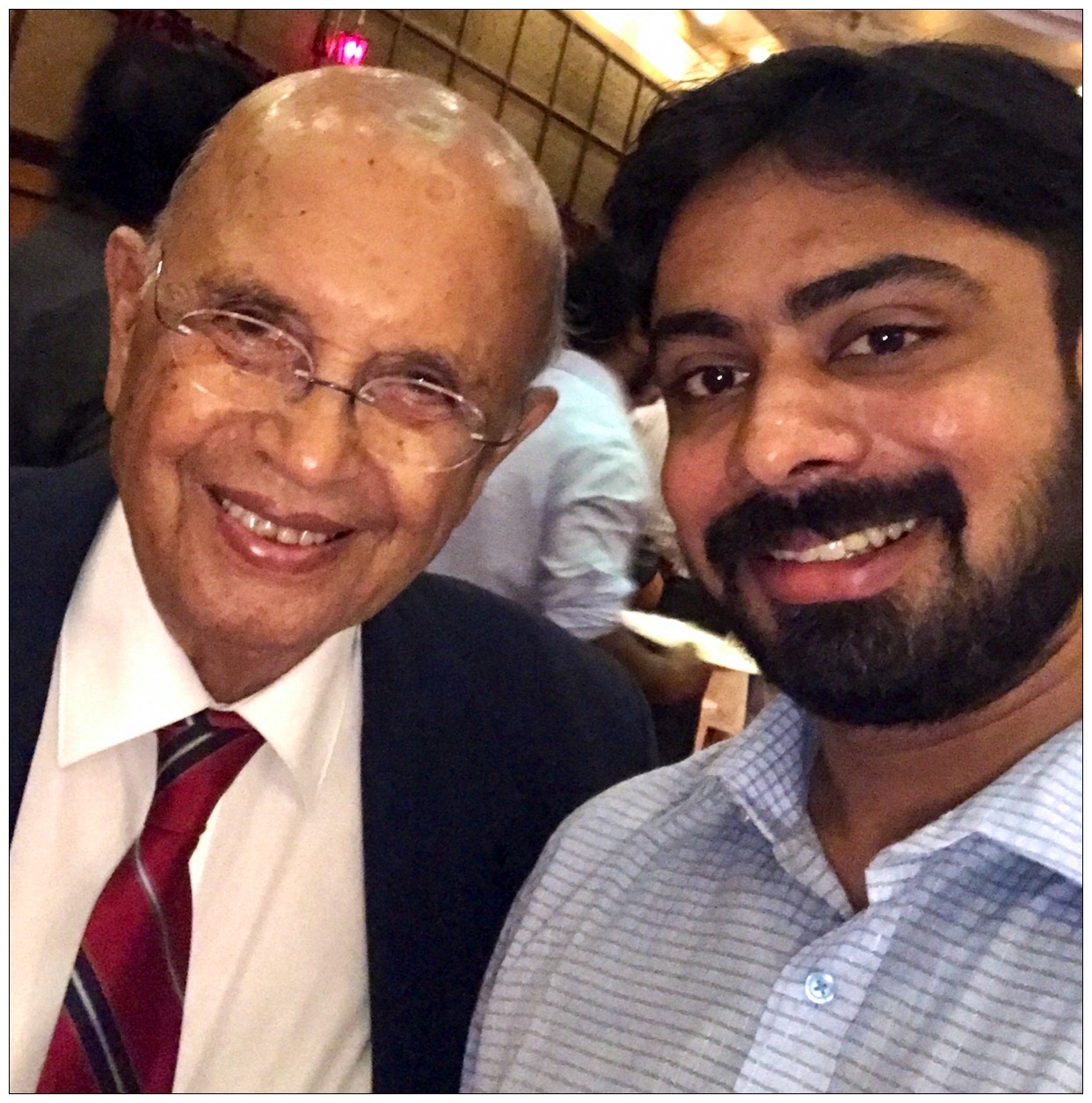 Dr Hirji Adenwalla smiling with Dr Varun Menon