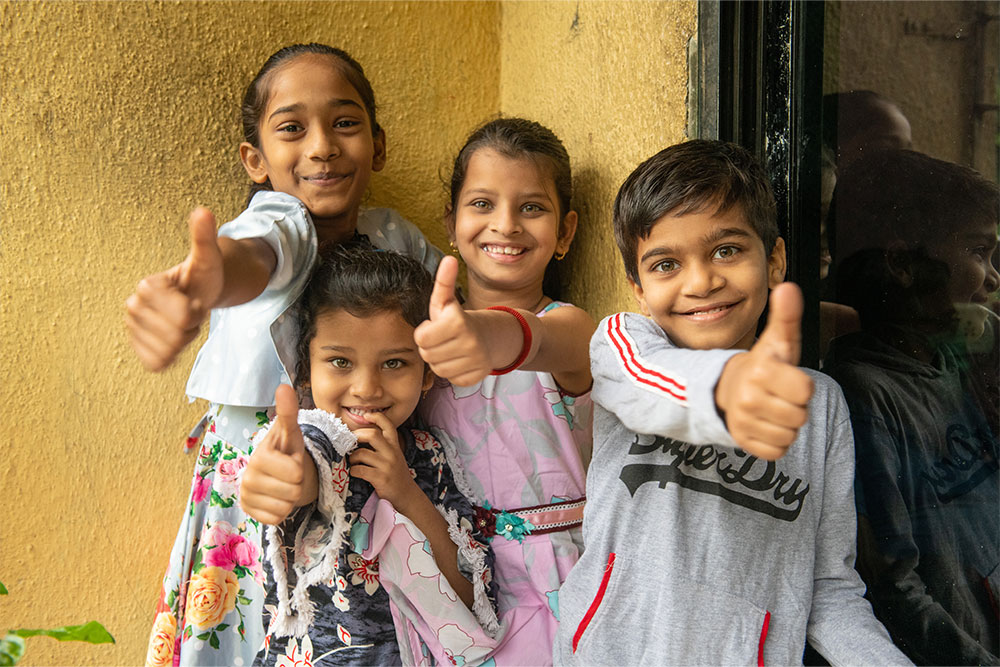 Samrat gives a thumbs up with his sister and cousins