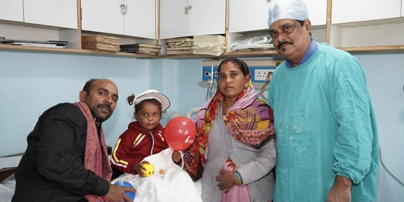 Dr. Sanjeev with a cleft patient and their family