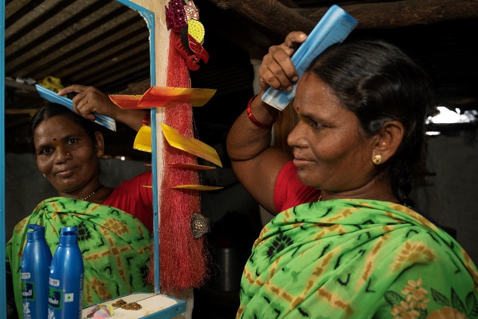 Surekha brushing her hair at home after cleft surgery