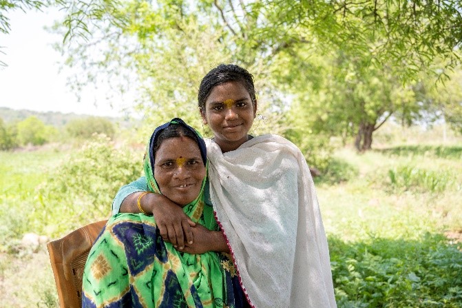 Surekha smiling with her daughter after cleft surgery