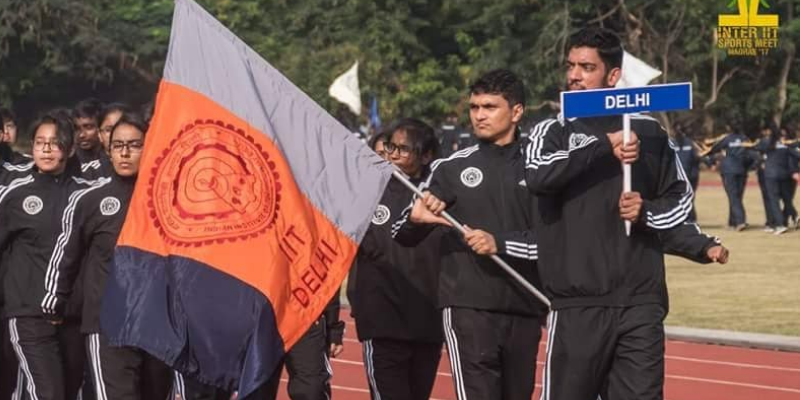 Ashim walking and bearing the flag of IIT Delhi