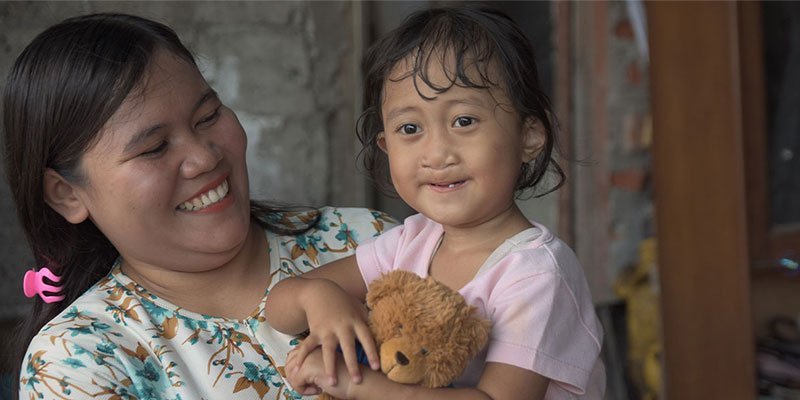 Adiba smiling with her mother Rizqiyana after her cleft surgery