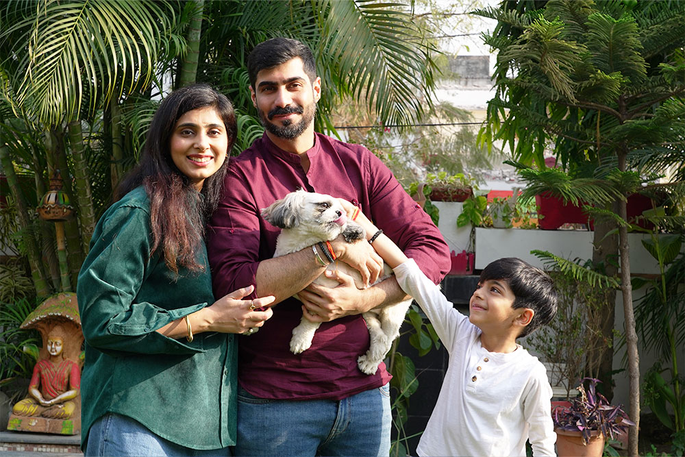Payal with her husband son and dog