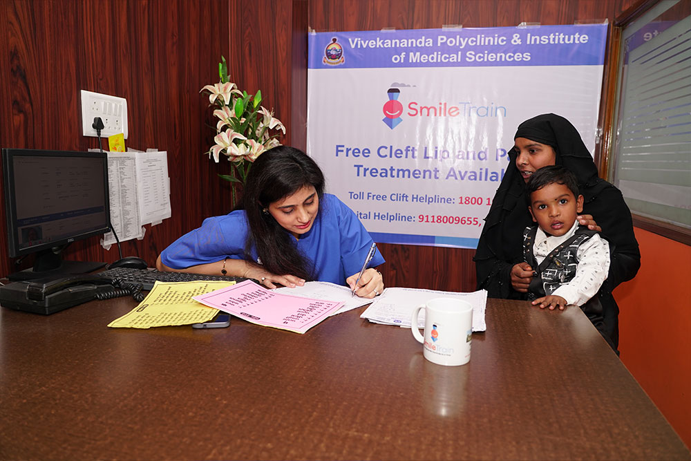 Payal reviewing a treatment plan with a patient’s mother