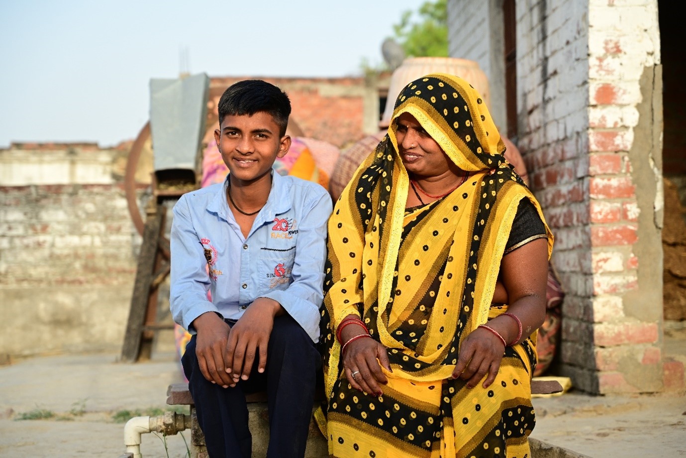 Monu smiling with his mother Guddu Devi after cleft surgery