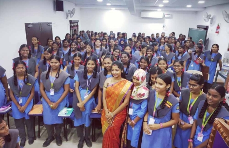 Dr Saranya Jaikumar smiling with a crowd