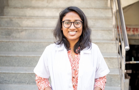 Dr Mayuri Kalyanpad smiling in a lab coat after cleft surgery