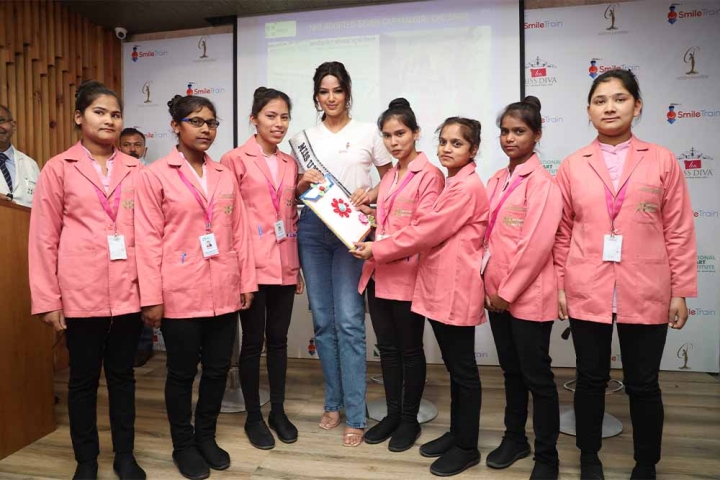 Harnaaz Sandhu smiling with nurses