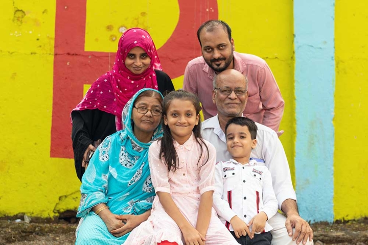 Humera smiling with her extended family