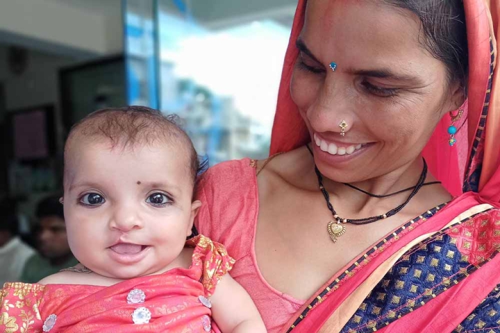 Sonali's mother holding her after her cleft surgery