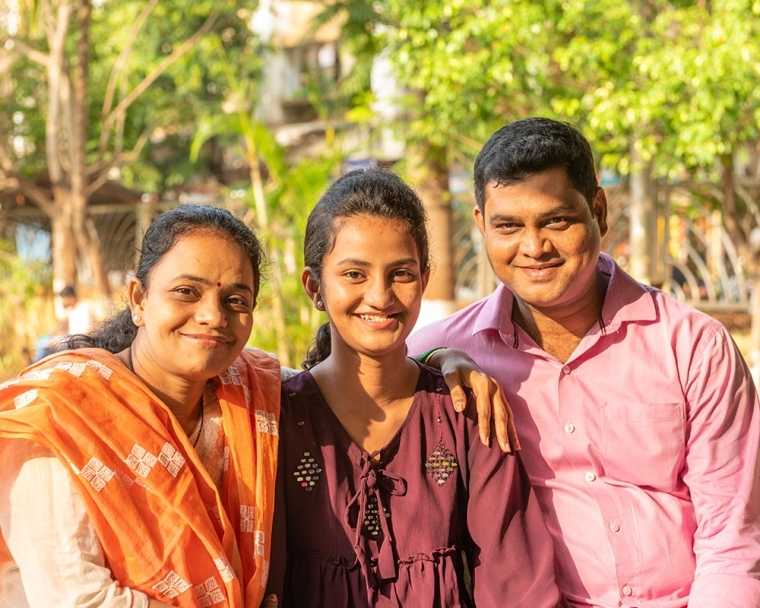 Bhargavi smiling with her parents after her cleft surgery