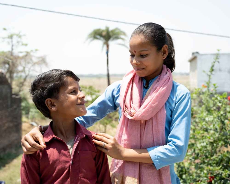 Shubham smiling with his mother after cleft surgery