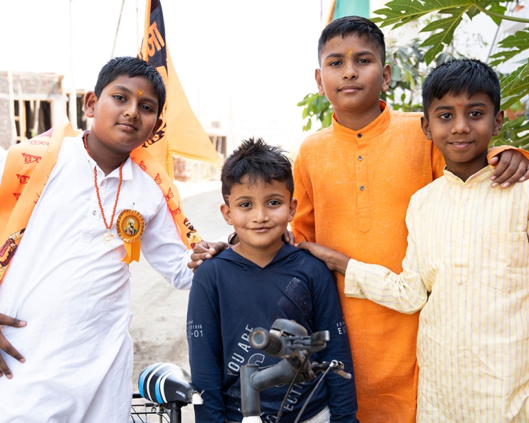Abhay smiling with his brothers after cleft surgery